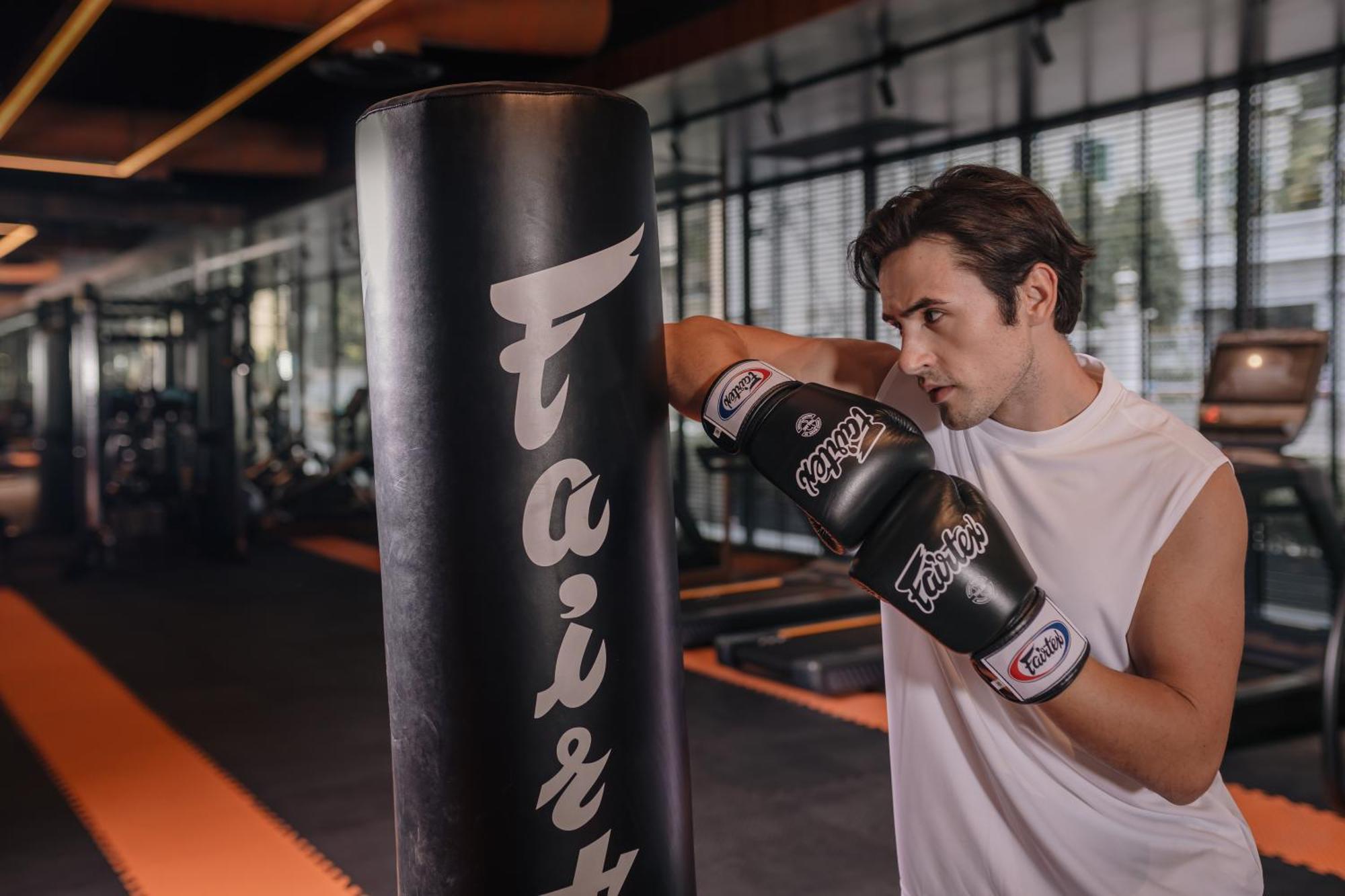 Nysa Hotel Bangkok Sukhumvit 11 Ngoại thất bức ảnh A boxer training with a heavy bag